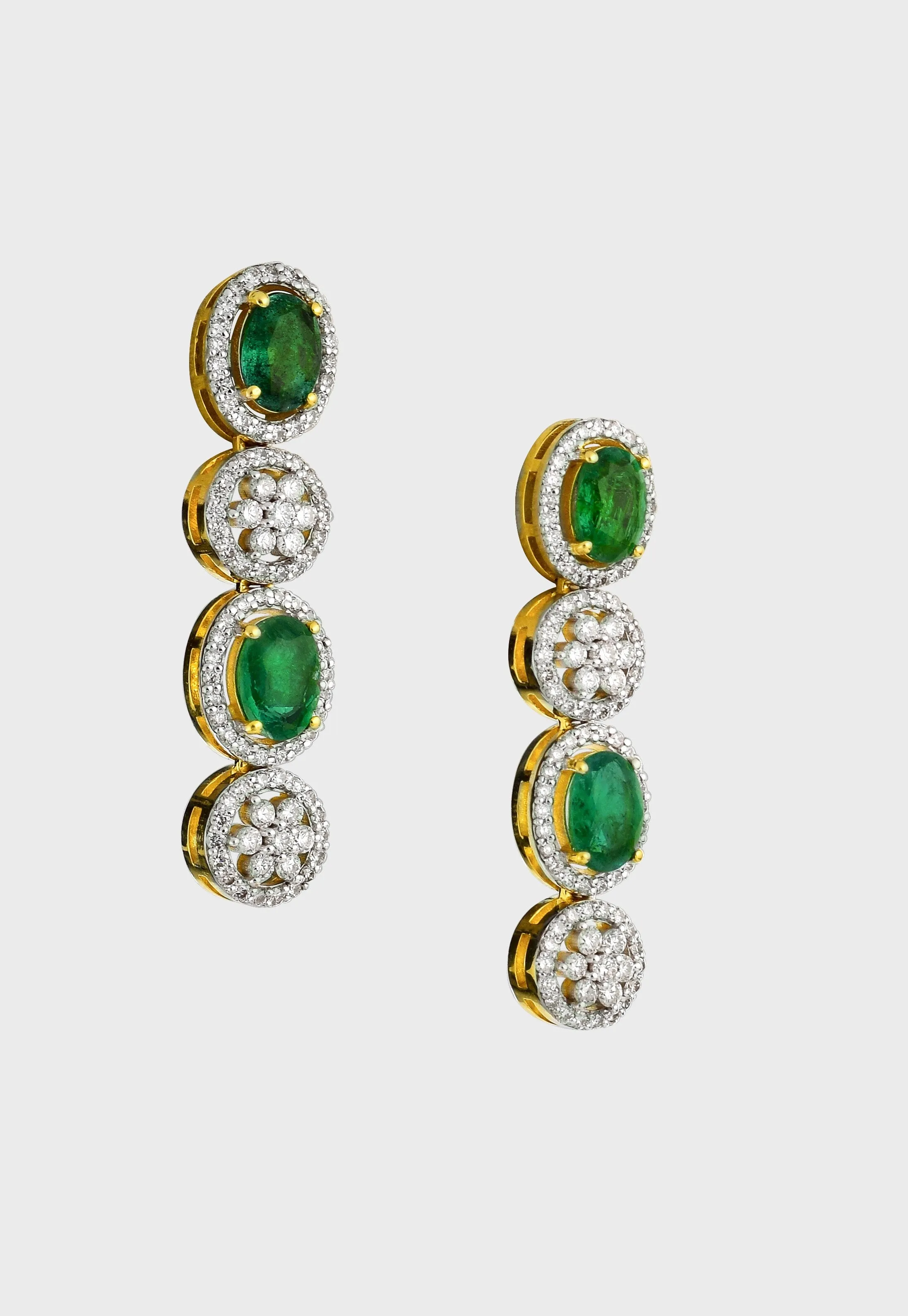 Enchant with elegance in our Emerald oval and diamond necklace and earring pair. Each piece exudes timeless sophistication and luxury.(GDNE0470)