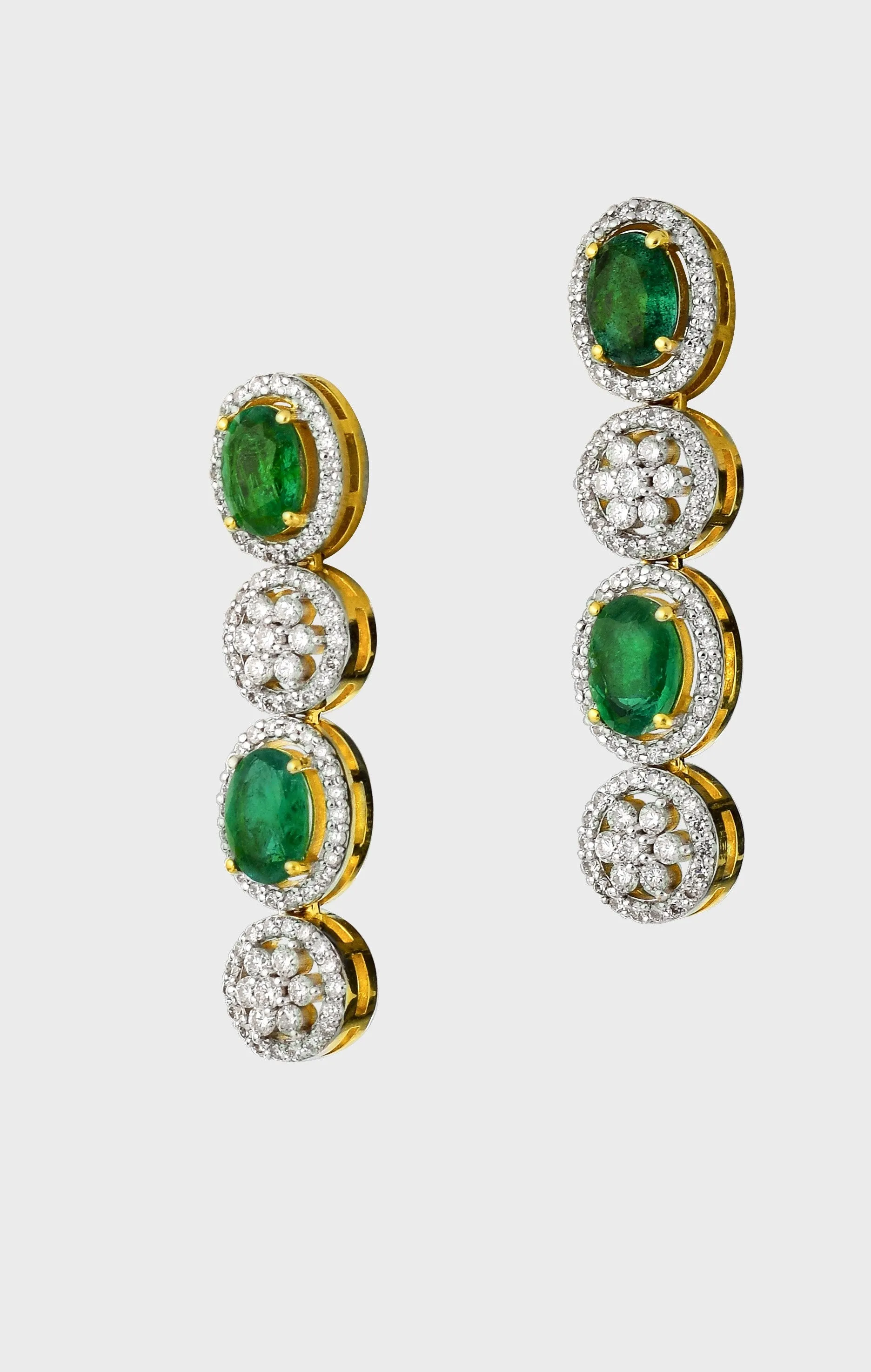 Enchant with elegance in our Emerald oval and diamond necklace and earring pair. Each piece exudes timeless sophistication and luxury.(GDNE0470)